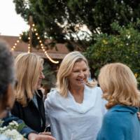 Group of alumni talking and smiling